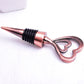 Metal wine stopper with bronze heart-shaped charm