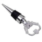 Metal wine stopper with starfish-shaped loop handle, black ribbed collar, silver finish.