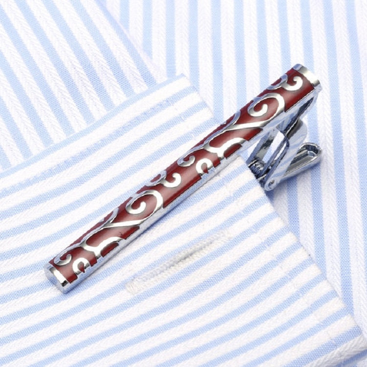 Enamel tie clip with red bar and swirling white pattern, silver metal clasp