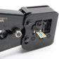 Close-up of black tool body with wire entry ports and colored cable ends