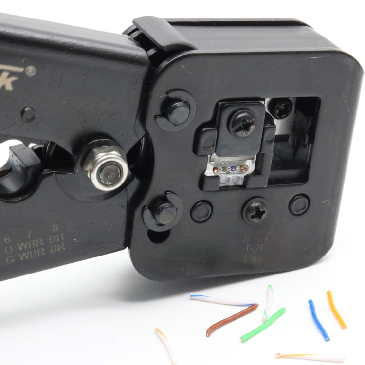 Close-up of cable termination tool port showing exposed contacts and colored wire leads