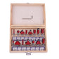 Wood router bit set open case showing assorted red and silver router cutters