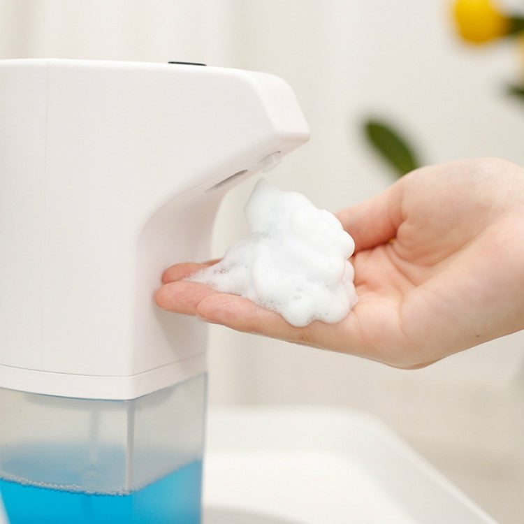 Wall-mounted automatic foam soap dispenser; blue reservoir, foamy soap dispensed