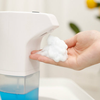 Wall-mounted automatic foam soap dispenser; blue reservoir, foamy soap dispensed
