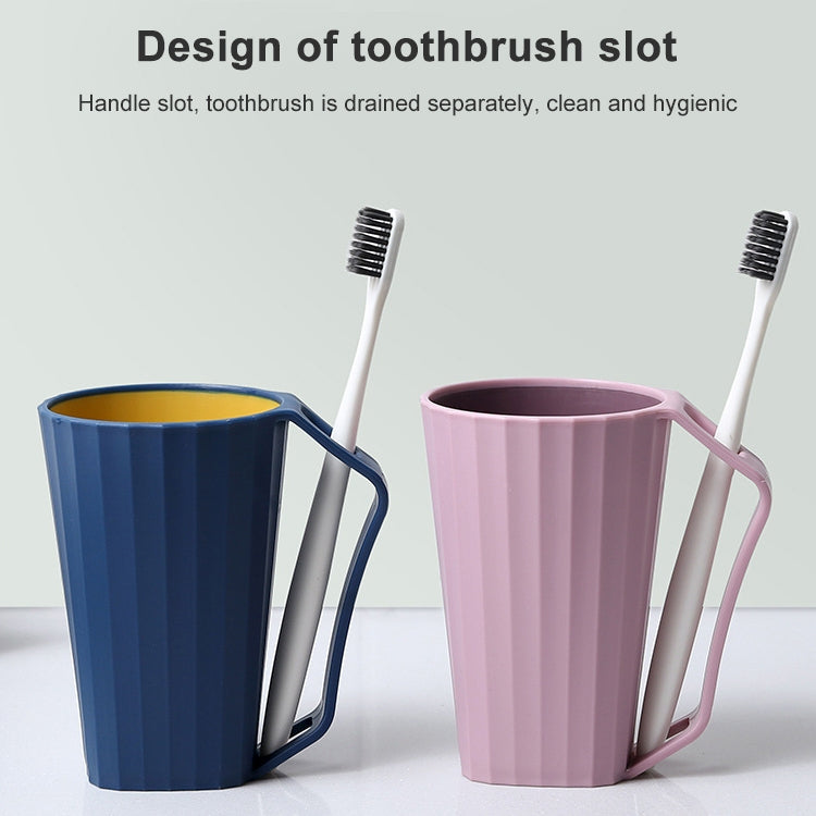 Blue and pink toothbrush rinse cups with handles and raised toothbrush slots.