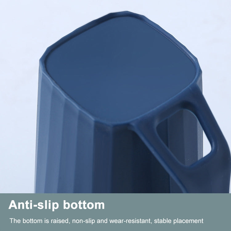 Blue plastic cup with handle, ribbed design, and raised anti-slip base.