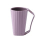 Pink ribbed cleaning cup with curved handle and smooth rim opening.