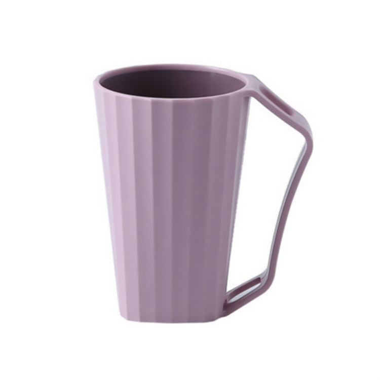 Pink ribbed cleaning cup with curved handle and smooth rim opening.