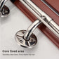 Folding wall-mounted shower chair with chrome rails and caster wheel under wood seat