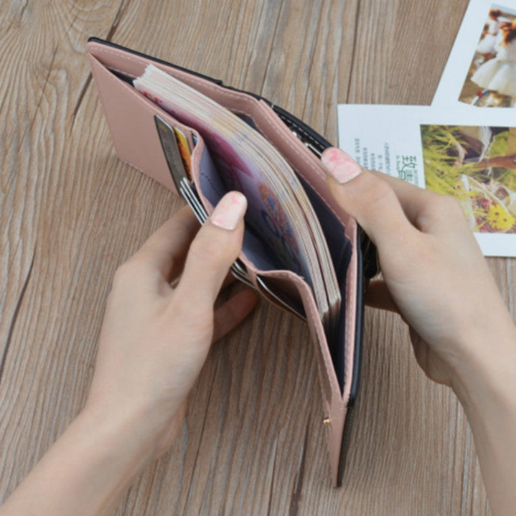 Folding coin purse wallet held open, showing interior lining and card compartments