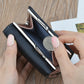 Black mini folding coin purse wallet open, showing card slots and a coin in view