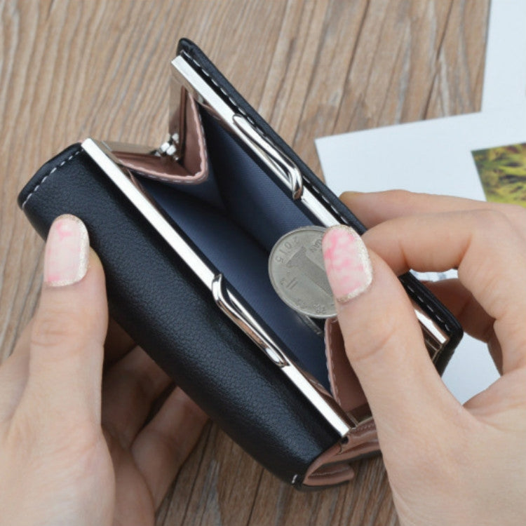 Black mini folding coin purse wallet open, showing card slots and a coin in view