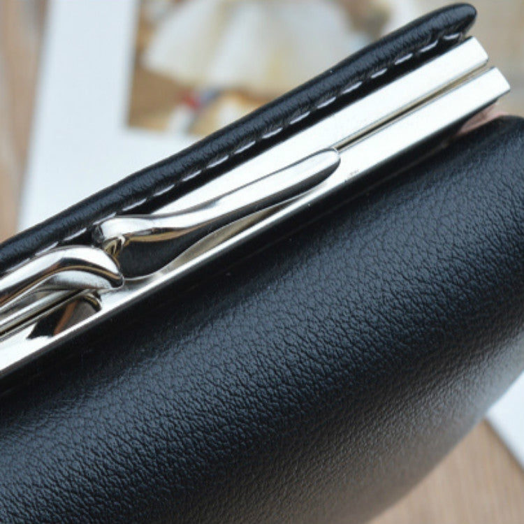Black folding coin purse wallet close-up with textured finish and metal kiss-lock frame