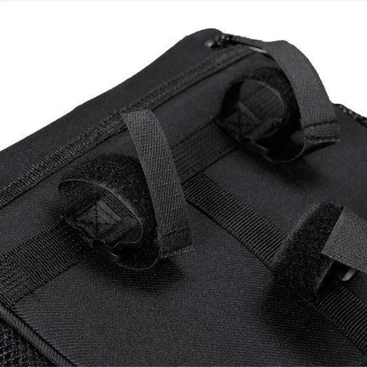 Black bike head bag close-up with zipper, elastic strap, and mesh pocket