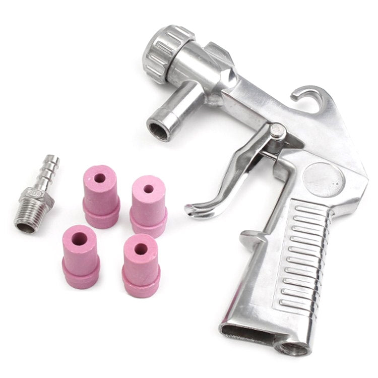 Pneumatic handheld sandblasting gun with purple abrasive nozzles and metal fittings