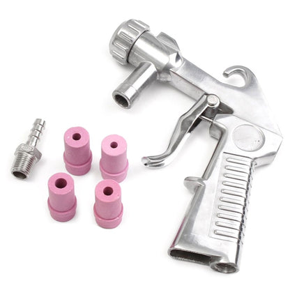 Pneumatic handheld sandblasting gun with purple abrasive nozzles and metal fittings