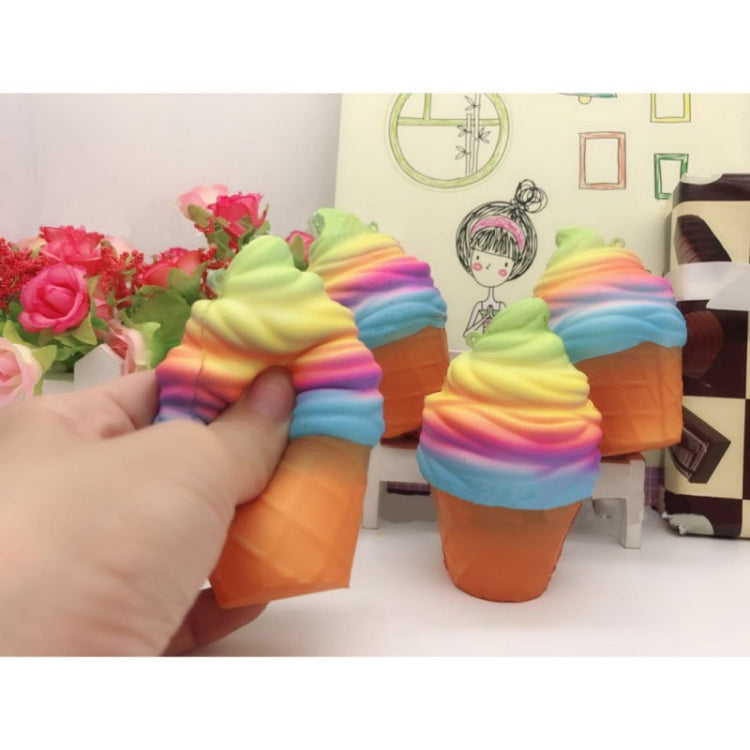Two rainbow ice cream cone squishy toys on display, orange cones with pink-blue-green swirl tops.