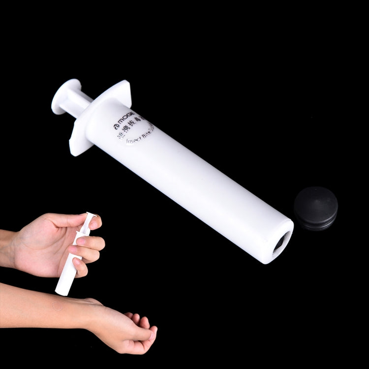 White venom extractor syringe, shown with person using it on a forearm