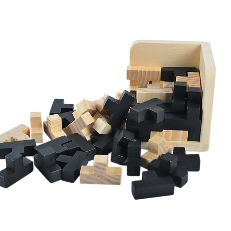 Wooden interlocking puzzle cube with many black and light wood interlocking pieces