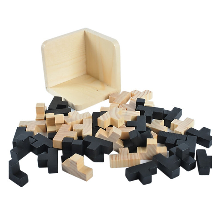 Wooden puzzle tray with scattered black and light wood interlocking blocks