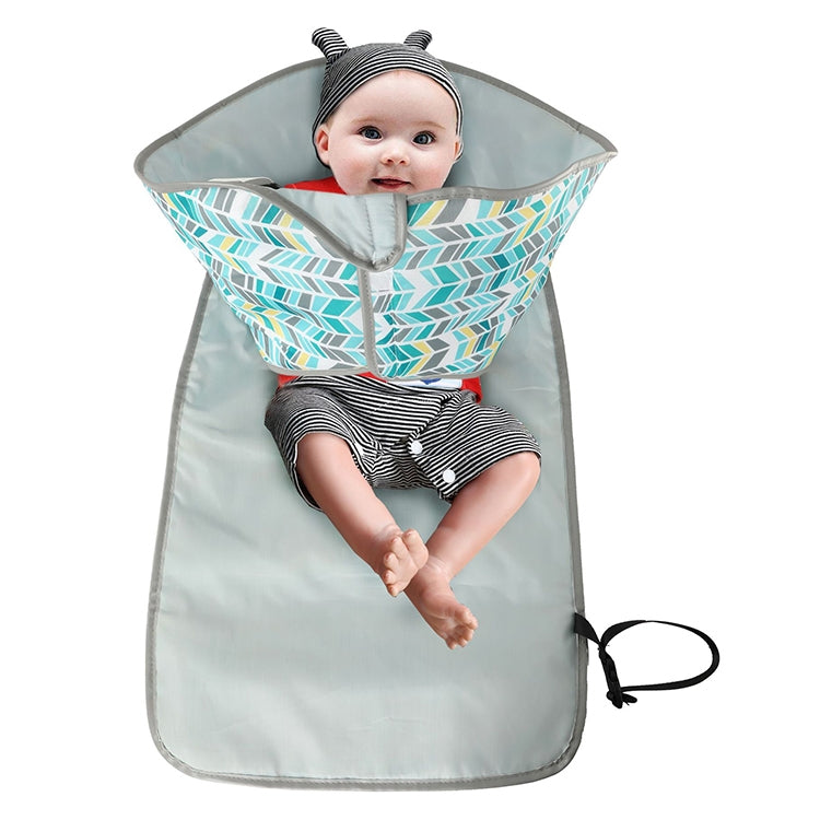 Gray waterproof baby changing pad with teal leaf-pattern cover and black fastening ties.