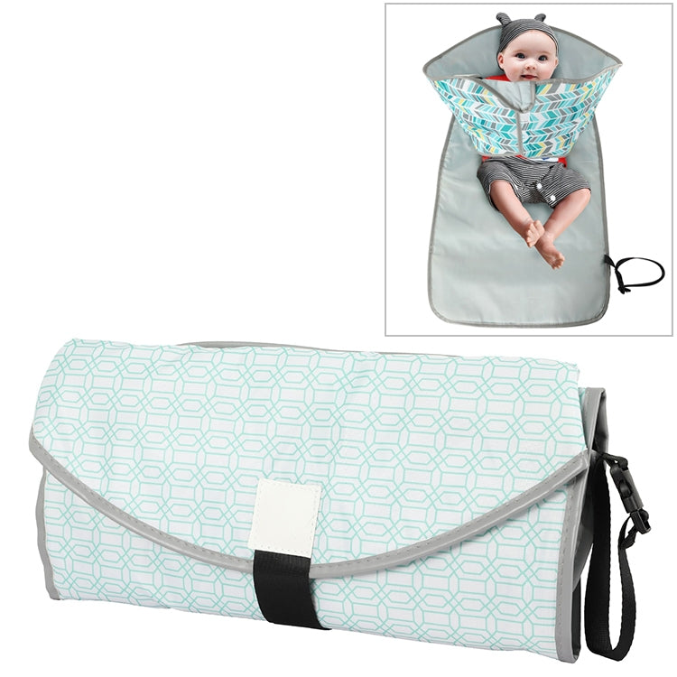 Foldable waterproof changing pad with light teal geometric pattern, gray sides, and black strap.
