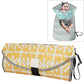 Folding waterproof changing pad, yellow and gray abstract pattern with carry handle.