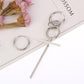 Silver-tone asymmetric long earrings featuring linked hoops and a straight bar detail.