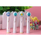 Clear covers on electric toothbrush heads, with colored bristles visible through