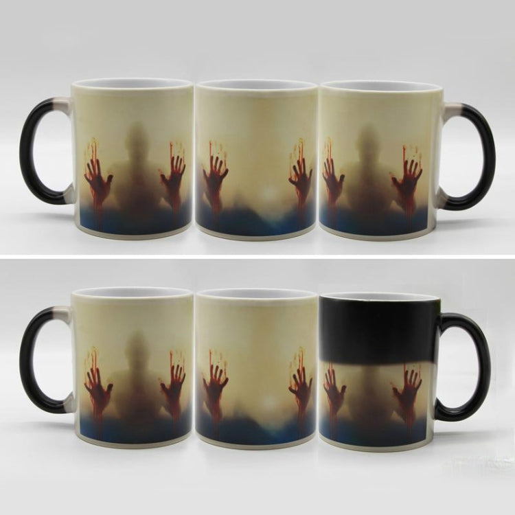 Set of six color-changing ceramic coffee mugs with red handprint graphic and black handles