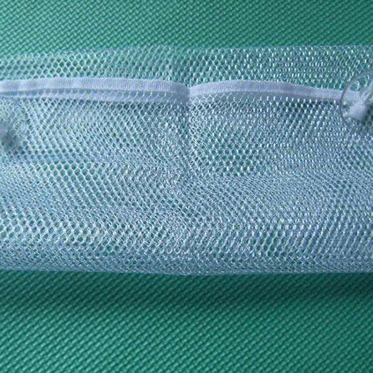 Blue mesh organizer pocket with suction cup detail, close-up view.