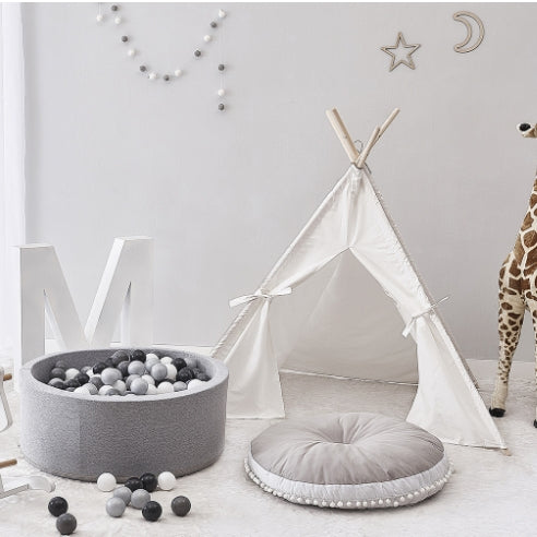 Gray round baby bean bag chair with bead-filled center insert