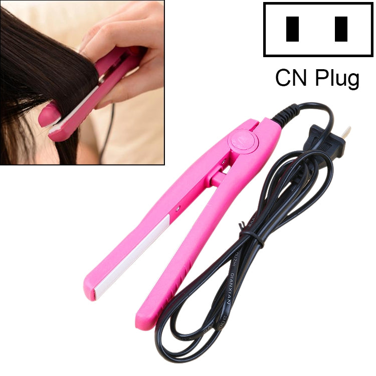 Mini hair straightener with pink ceramic plates and coiled power cord