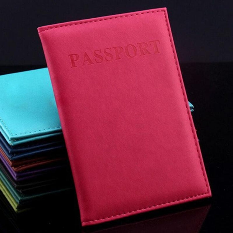 Rose red faux leather passport travel cover with embossed PASSPORT title and stitched edge