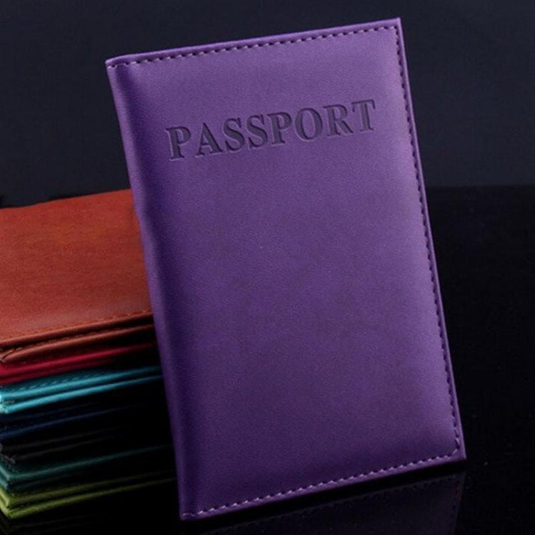 Purple faux leather passport travel cover with embossed PASSPORT title and stitched border