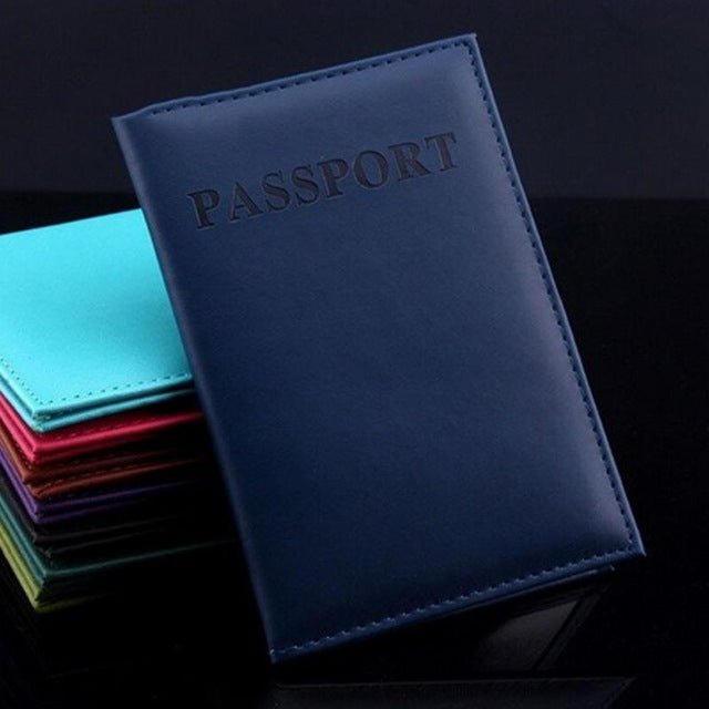 Deep blue faux leather passport travel cover with embossed PASSPORT title and stitched border