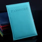 Aqua faux leather passport travel cover with embossed PASSPORT title and stitched border