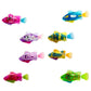 Set of eight colorful plastic fish toys shown floating on white background