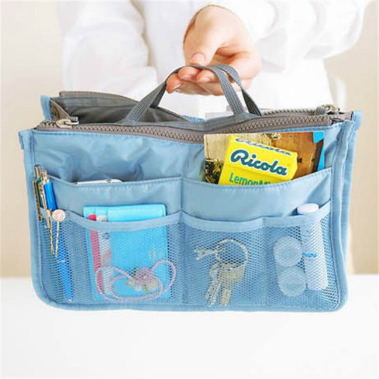 Sky-blue waterproof folding travel bag with zip top and mesh interior pockets