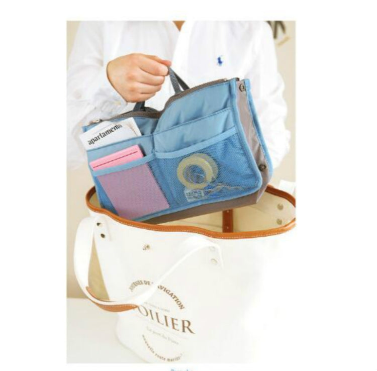 Sky-blue waterproof folding travel bag with side opening and divided interior pockets