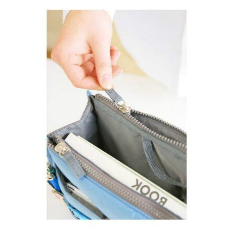 Gray waterproof folding travel bag with zip closure and interior compartments