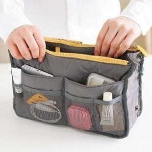 Gray waterproof folding travel bag with multiple mesh pocket organizers and zip top