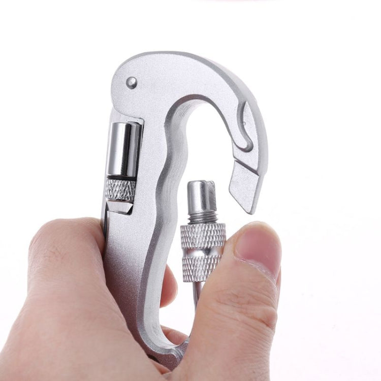 Silver carabiner multitool with serrated saw blade, held by hands