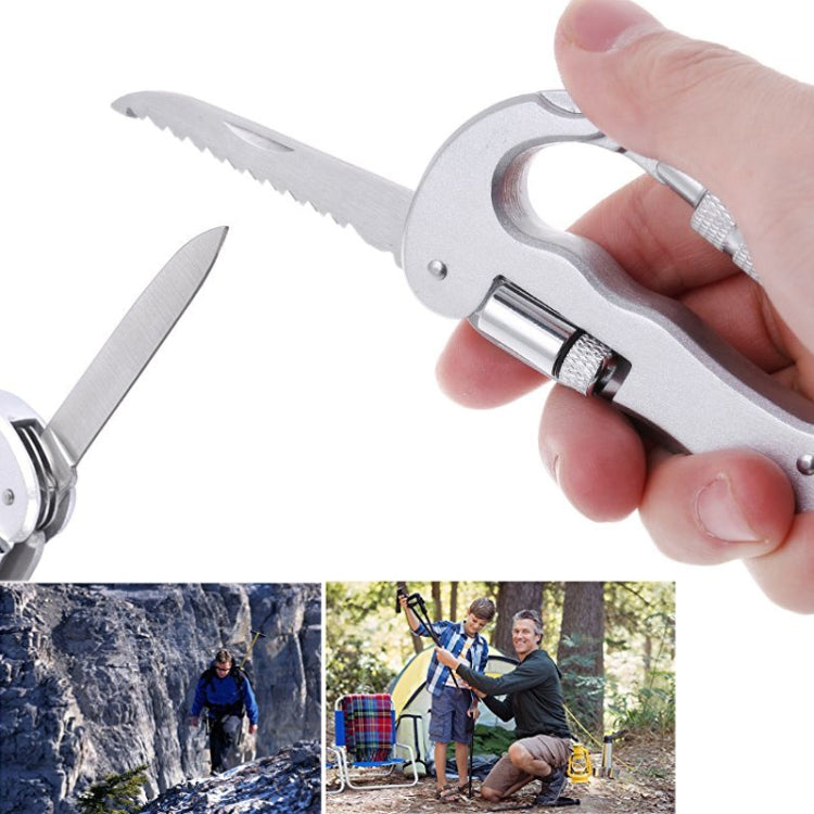 Folding saw carabiner multitool with compact blade, gripped by hand