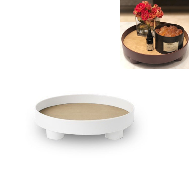 White round desktop storage tray with raised rim and small feet