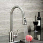 Chrome sink faucet sprayer nozzle releasing a focused water stream from head