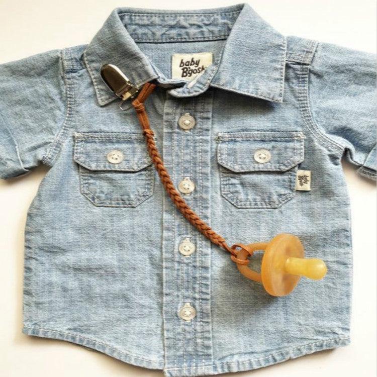 Light blue denim baby shirt with brown braided pacifier chain clip