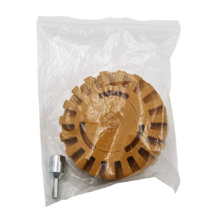 Rubber polishing wheel in plastic bag, yellow-brown toothed disc with metal shank