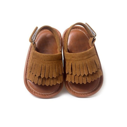 Dark brown fringed baby sandals with hook-and-loop ankle strap and open toe