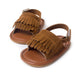 Brown fringed baby sandals with hook-and-loop strap, front and side view
